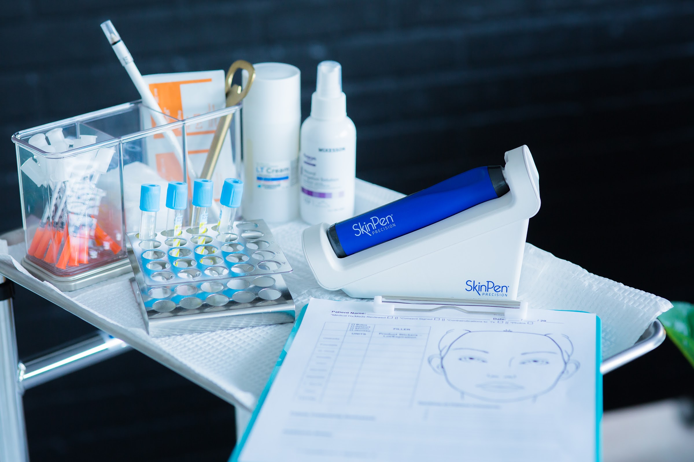 SkinPen Precision microneedling device on a clinical treatment tray